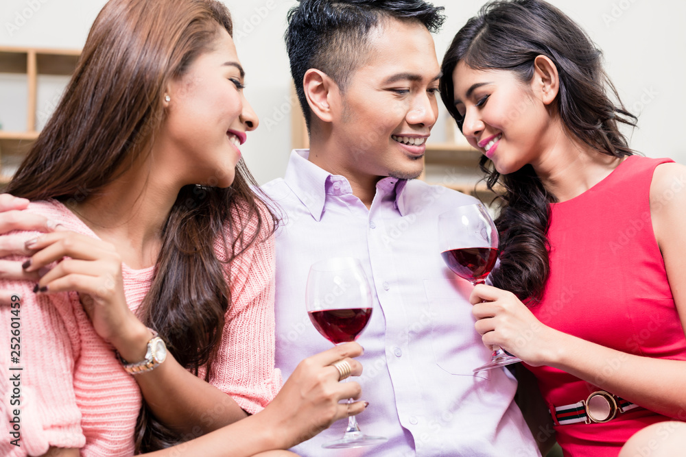 Pretty women enjoying drinks with young man Pretty women enjoying drinks with young man