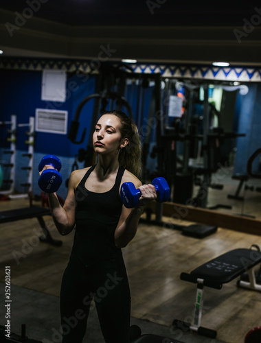 Young girl trains hard in the gym © lymdigital