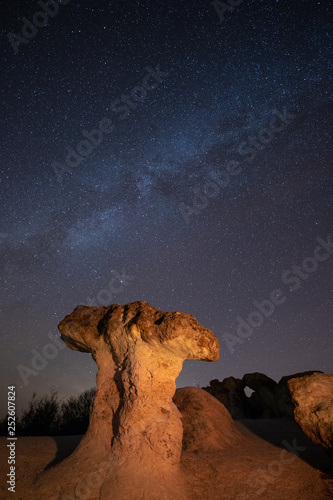 Mushroom rocks phenomenon under the night sky with Milky Way