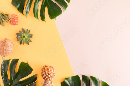 Summer fruits and leaves. Tropical palm leaves, pineapple, coconut on pastel ...