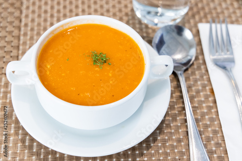 Serving of creamy tomato soup at restaurant © ThamKC