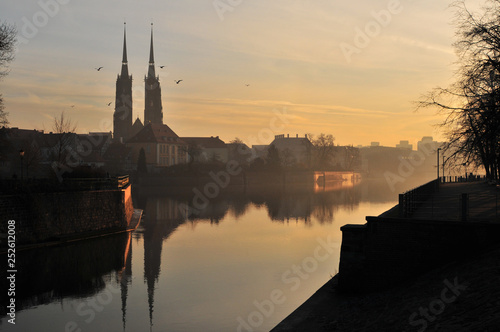 Cathedral of St. John the Baptist twin towers Odra river sunset Wroclaw, Poland, Europe