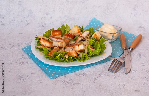 Caesar salad with chicken, cheese and croutons. The concept of a healthy lifestyle.