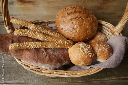  bread and breadsticks on a wooden background close-up