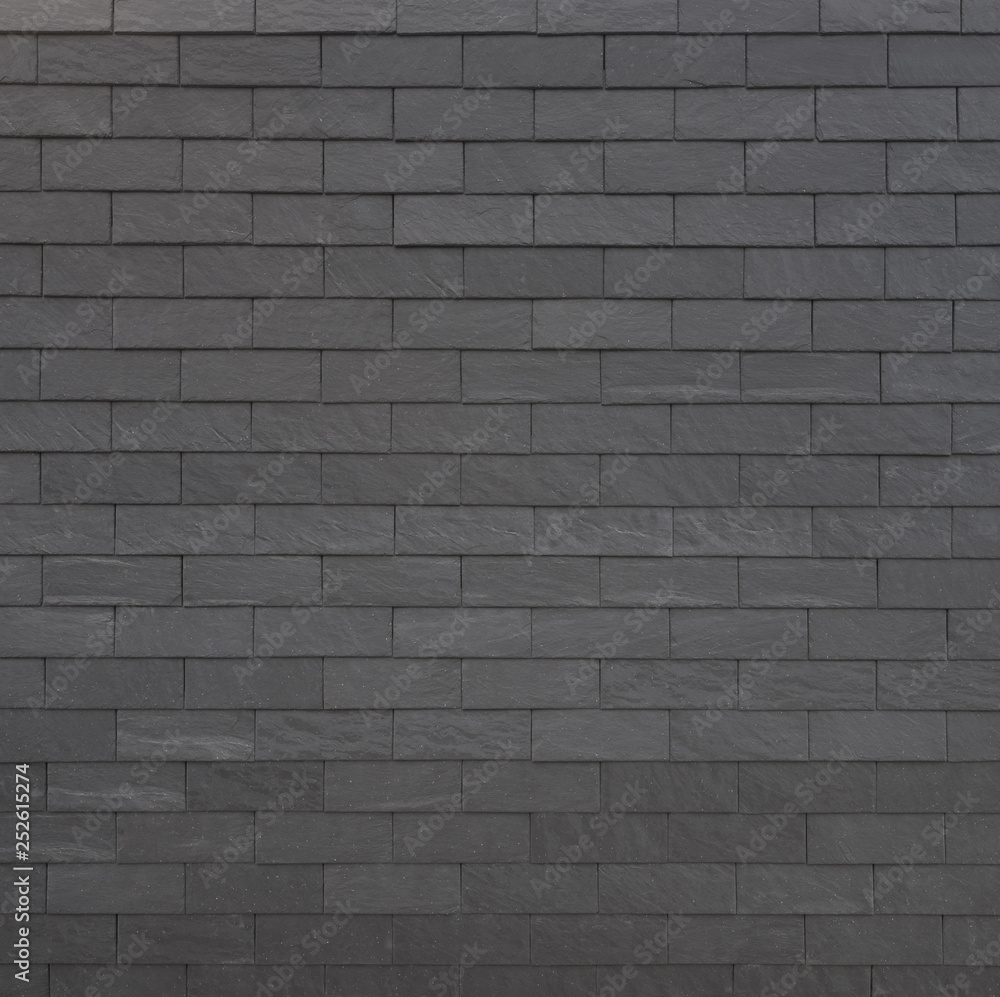 Black stone facade panels with for buildings texture background. Black stone facade panels with for buildings texture background.