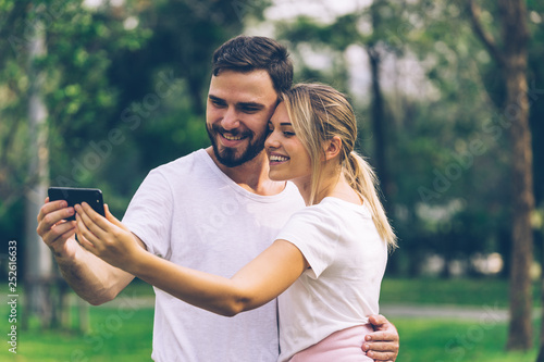 Man and Woman couple Lover selfie together in public park