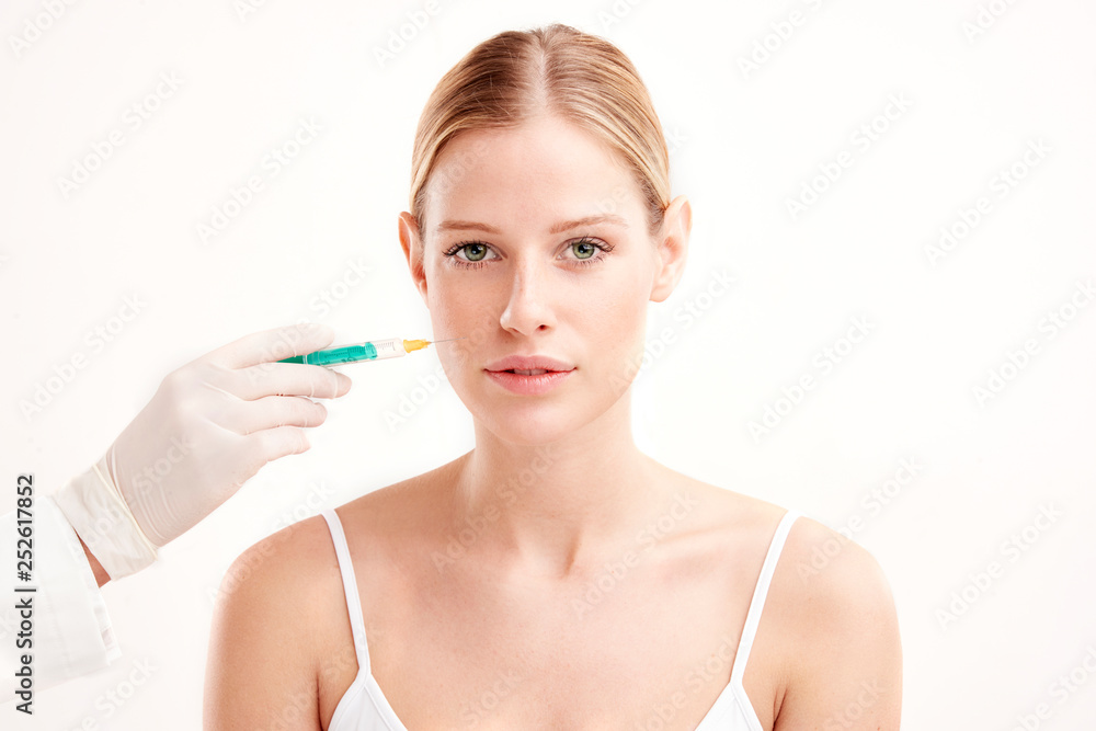 Close-up portrait of young woman having botox treatment Close-up portrait of young woman having botox treatment