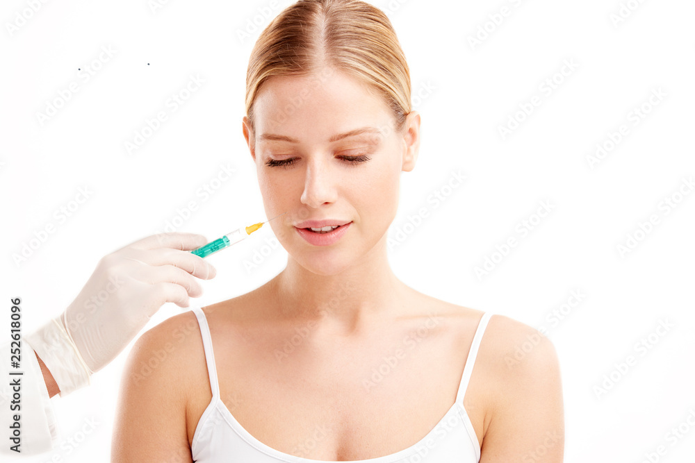 Close-up portrait of young woman having botox treatment Close-up portrait of young woman having botox treatment