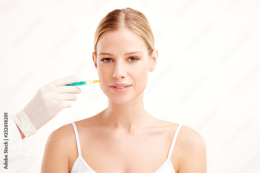 Close-up portrait of young woman having botox treatment Close-up portrait of young woman having botox treatment
