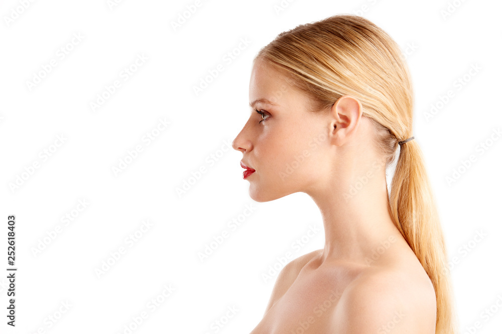Close-up profile face of beautiful young woman posing at isolated white background Close-up profile face of beautiful young woman posing at isolated white background