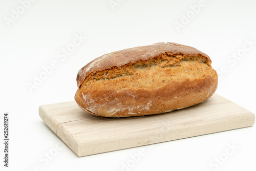 freshly baked bread lies on a wooden board