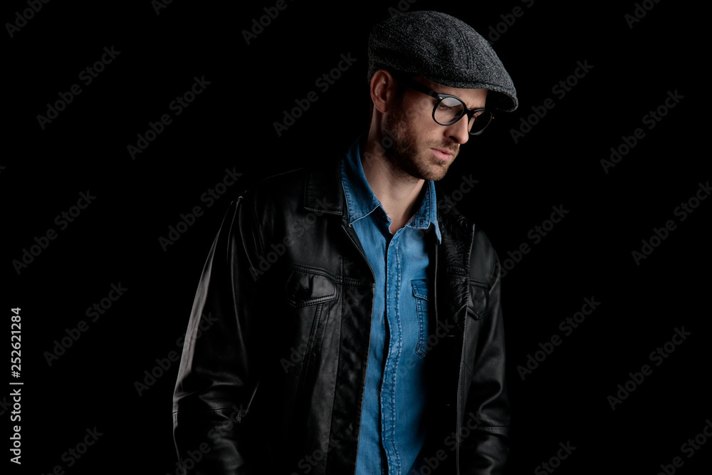 man with black leather jacket looking away