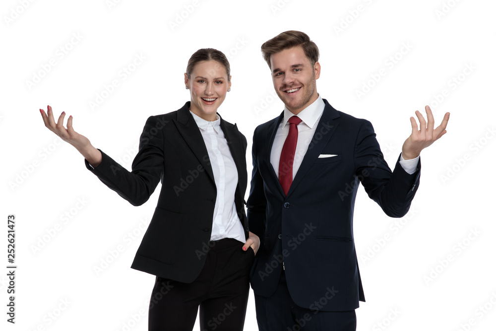couple in business suits questioning with hands gesture couple in business suits questioning with hands gesture
