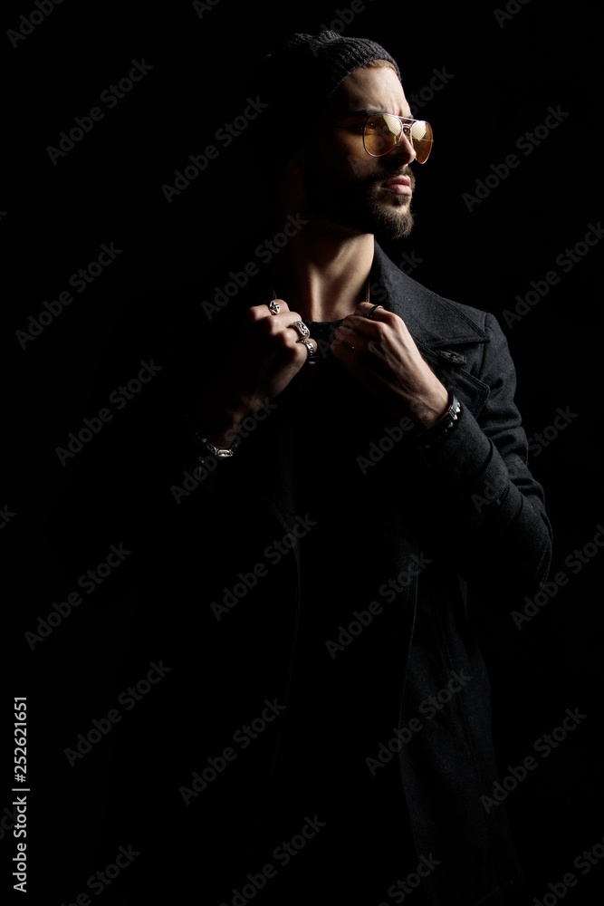 Man wearing modern clothes, looking sideways Man wearing modern clothes, looking sideways