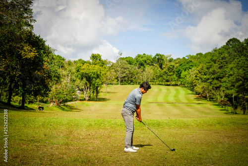 Golfer playing golf in beautiful golf course in the evening golf course with sunshine in thailand