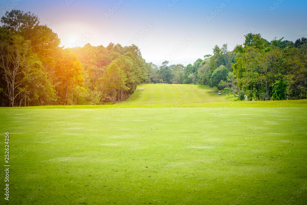 The evening golf course has sunlight shining down at golf course in Thailand The evening golf course has sunlight shining down at golf course in Thailand