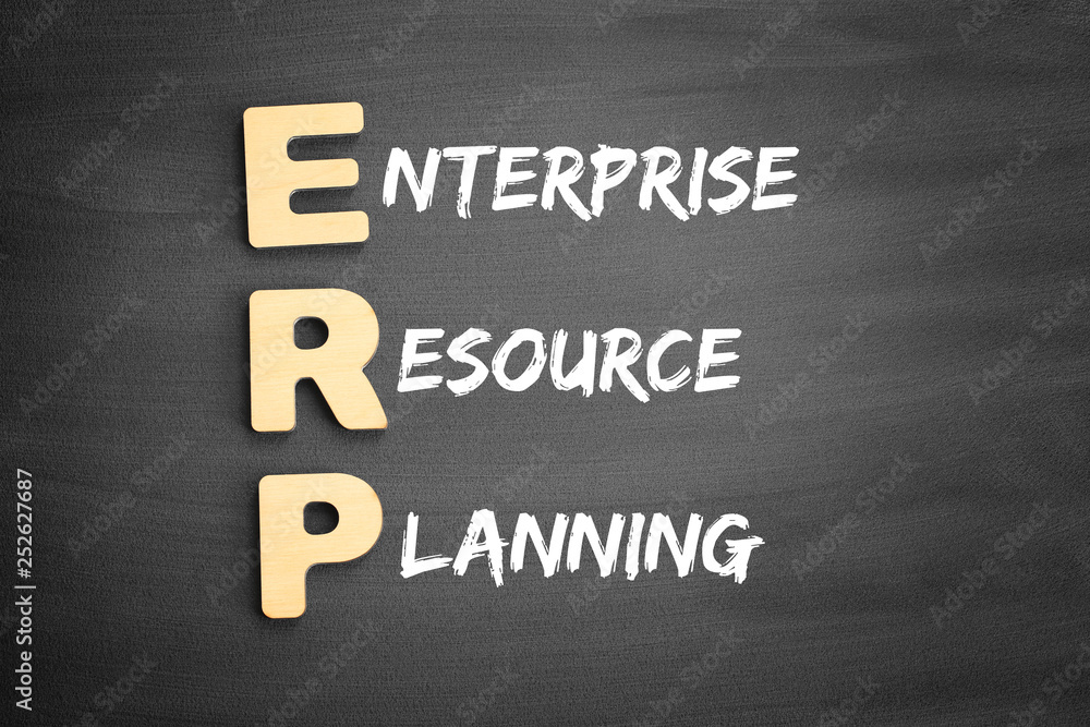Fototapeta premium Wooden alphabets building the word ERP - Enterprise Resource Planning acronym on blackboard