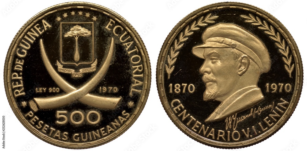 Equatorial Guinea Guinean golden coin 500 five hundred pesetas 1970, subject Vladimir Lenin, shield with tree above ribbon and crossed tusks, head left divides dates, Equatorial Guinea Guinean golden coin 500 five hundred pesetas 1970, subject Vladimir Lenin, shield with tree above ribbon and crossed tusks, head left divides dates,