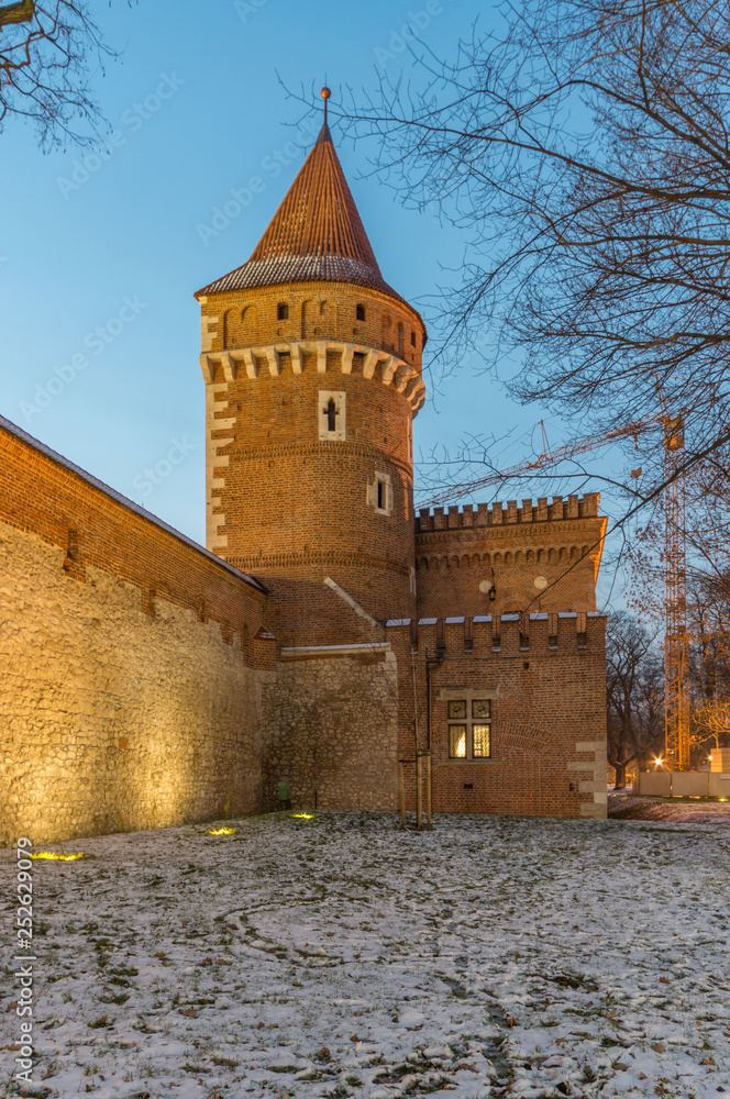 Krakow, Poland, medieval Stolarska tower and city arsenal in the night