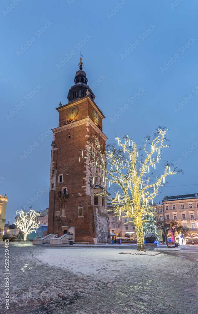 Obraz premium Krakow, Poland, Christmas decoration on Main Market Square and Town Hall tower