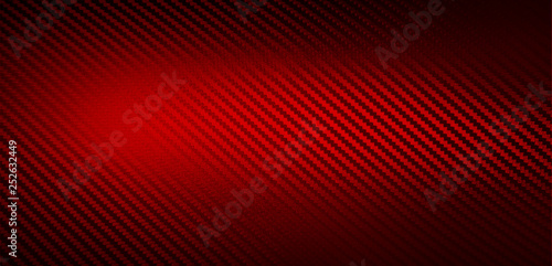 Metallic shiny texture of red carbon fiber self-adhesive paper. Material for racing car modification. Material design for background, wallpaper, graphic design