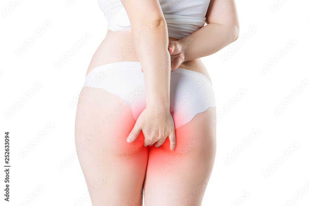 Woman suffering from hemorrhoids, anal pain isolated on white background