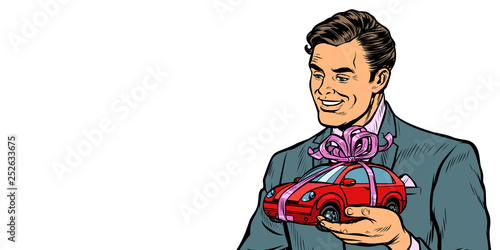 Businessman gives a gift, selling cars. Isolate on white background