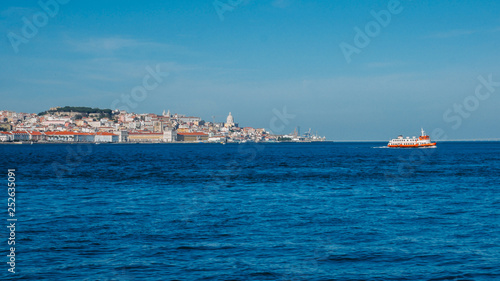 High perspective panorama of Lisbon old city center  view from Almada  Portugal with ferry boat crossing