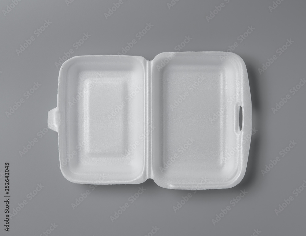 Open white styrofoam lunch box for takeaway food on grey background for print design and mock up Open white styrofoam lunch box for takeaway food on grey background for print design and mock up