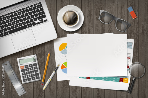 Blank white sheet of paper with laptop.