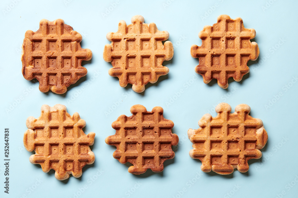 Homemade Viennese waffles on blue background Homemade Viennese waffles on blue background