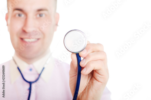 Doctor with a stethoscope bell in his hand on white background