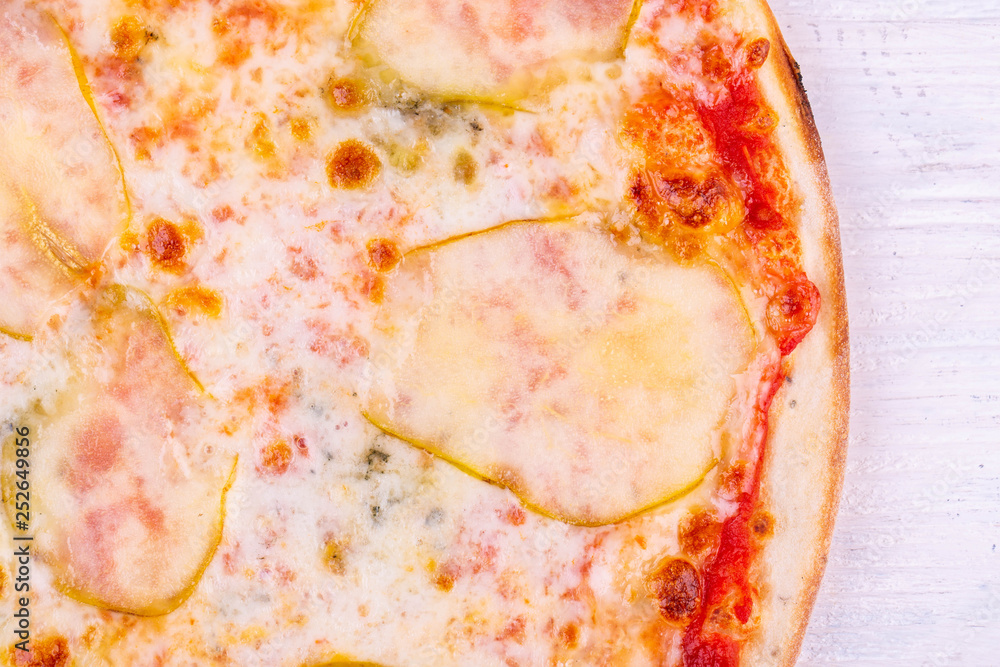 Fragment of pizza with pear and cheese Fragment of pizza with pear and cheese