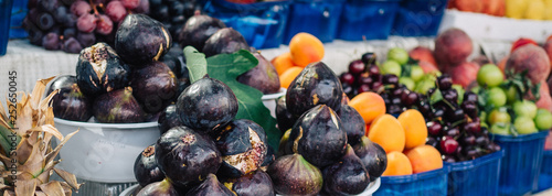 Sunny day. Fruit and vegetable market. Stand with fresh fruit, mostly figs, in a market Tirana, Albania