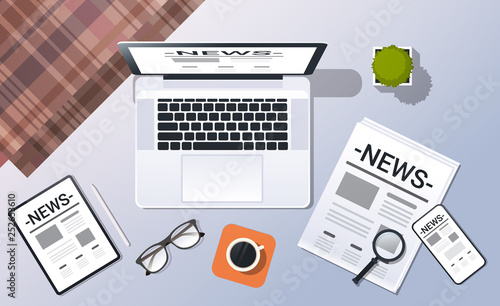 mass media news concept top angle view desktop laptop smartphone tablet newspaper office stuff horizontal