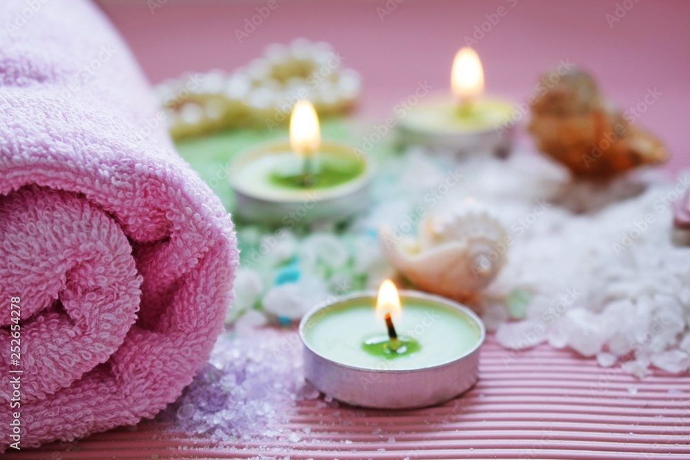 Colorful bath salt on pink background.Healthy skin care.