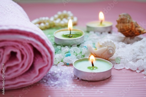 Colorful bath salt on pink background.Healthy skin care.