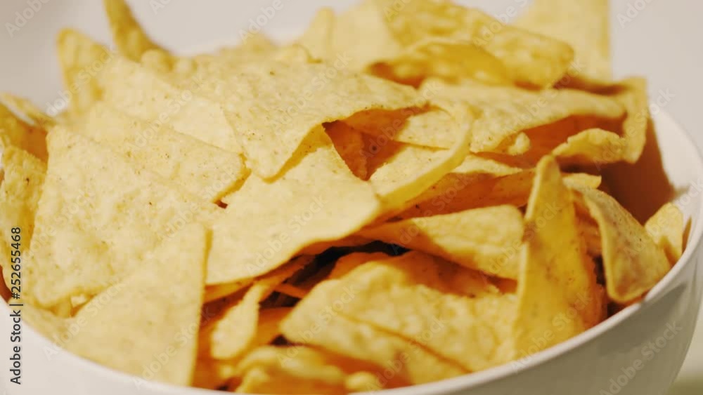 Pile of tortilla chips on the plate, close-up shot Pile of tortilla chips on the plate, close-up shot