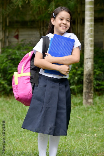 Happy Catholic Student Child Wearing School Uniform With Books © dtiberio