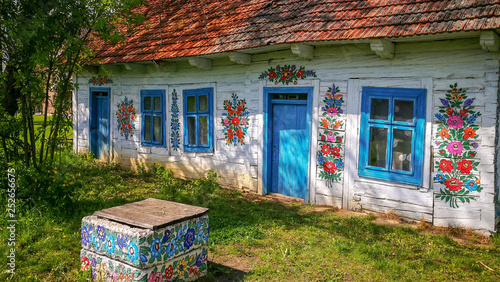 Wall of a traditional colorful building in Zalipie village in Poland.