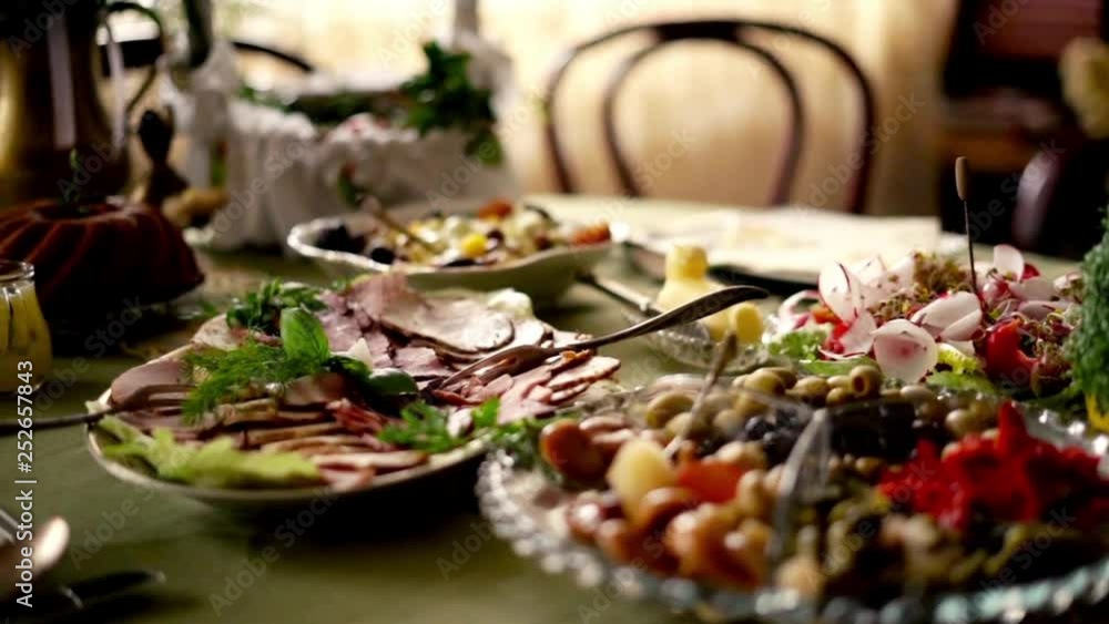 Closeup around table during easter brekfast, super slow motion Closeup around table during easter brekfast, super slow motion