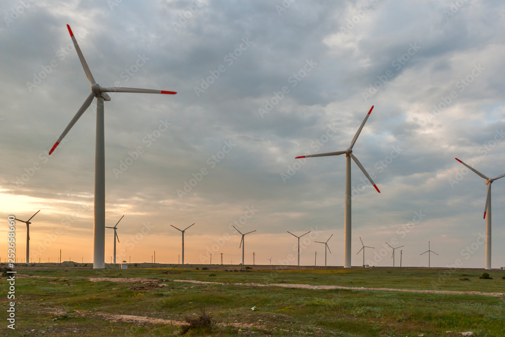 Sunset landscape with Wind turbines near Kaliakra Cape at Black Sea Coast, Dobrich Region, Bulgaria, Sunset landscape with Wind turbines near Kaliakra Cape at Black Sea Coast, Dobrich Region, Bulgaria,
