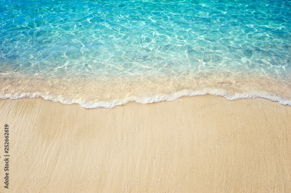 Soft blue ocean wave on clean sandy beach - obrazy, fototapety, plakaty 