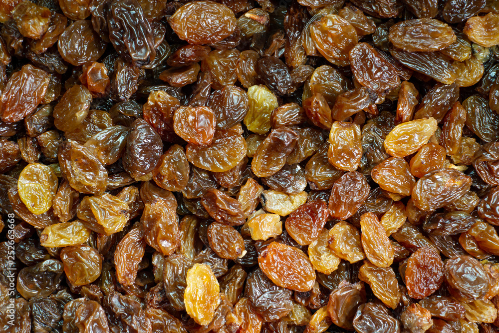 Sultanas washed and dried in close up. Macro background. Sultanas washed and dried in close up. Macro background.