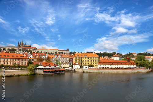 Old town of Prague over river Vltava with Saint Vitus cathedral on skyline.