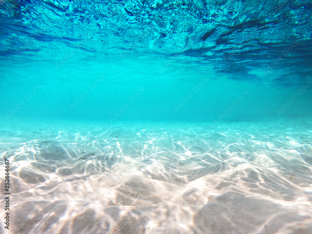 Underwater scene with sun ray background