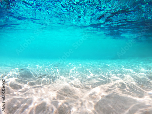 Underwater scene with sun ray background