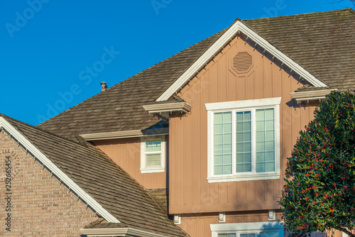 The top of the house or apartment building with nice window.