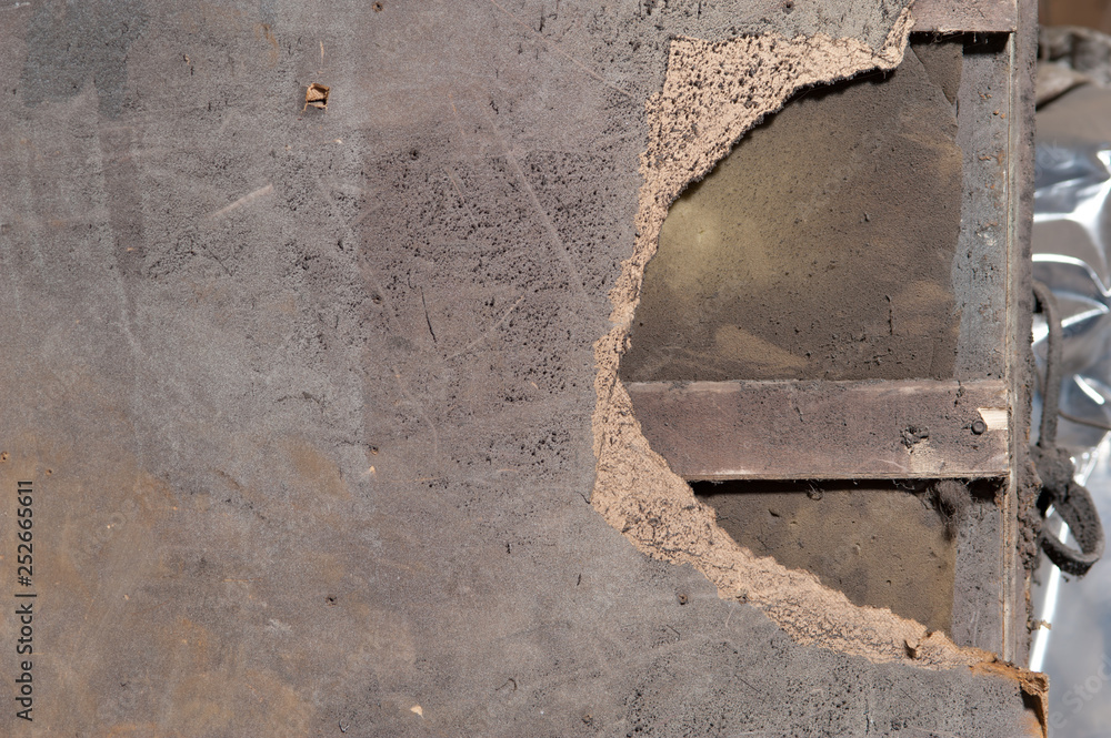 Surface of sawdust door with a piece torn Surface of sawdust door with a piece torn