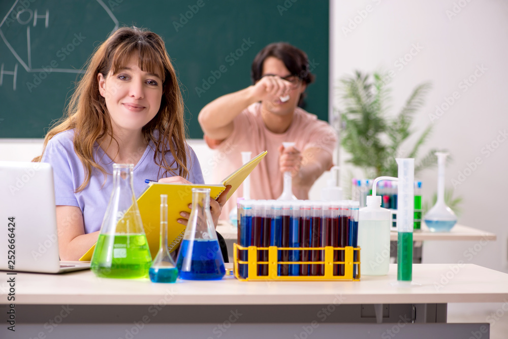 Two chemists students in classroom Two chemists students in classroom